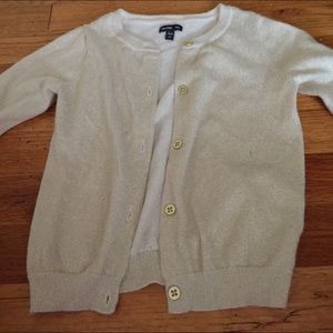 I’m selling a gold cardigan.